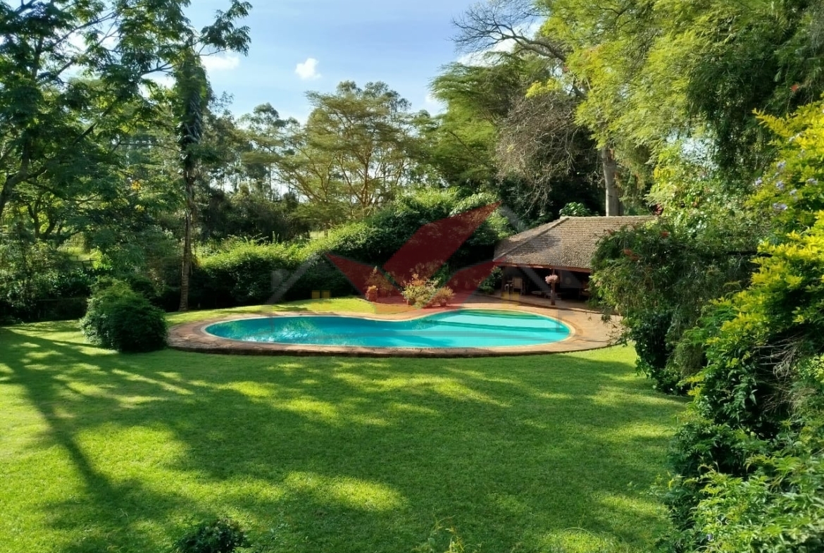 ## Prime 4-Acre Estate for Sale in Karen – US$ 2.65 Million Location: Karen, Nairobi Price: US$ 2.65 Million (Slightly negotiable) Discover the epitome of luxury living on this 4-acre estate in the prestigious Karen area, surrounded by lush indigenous trees, offering a private and serene environment. Perfect for those seeking an expansive and well-equipped property, this estate boasts not only a 4-bedroom cottage and a 3-bedroom cottage but also a wealth of premium amenities. ### Property Features: - 4 Acres of Land: Fertile red soil with mature indigenous trees. - Main Cottage: 4 spacious bedrooms, 2 ensuite. - Secondary Cottage: 3 bedrooms with the master ensuite. - Staff Quarters (DSQ): Accommodates 6 staff members. - Borehole with Water Reservoir: Ensures a reliable and abundant water supply. - Automatic Power Backup Generator: For uninterrupted power during outages. - Swimming Pool: Perfect for relaxation and entertainment. - Equestrian Facilities: Paddocks, stables, and a horse arena, ideal for horse enthusiasts. - Electric Fence: Enhanced security throughout the compound. - Proximity to Karen Country Golf Club: A short distance from one of Nairobi’s most prestigious golf clubs. ### Why This Property? - Exclusive Location: Nestled in Karen, one of Nairobi’s most sought-after residential areas. - Luxury & Privacy: A sprawling estate offering space, privacy, and top-tier amenities. - Ideal for Equestrian Enthusiasts: Equipped with paddocks, stables, and a horse arena. This stunning estate is a rare find and offers a blend of luxury and functionality, making it ideal for both residential and investment purposes. Contact us to schedule a viewing or for further details: 📞 Call or WhatsApp: [0732675057](https://wa.me/254732675057) 💬 [Click here to send a WhatsApp message](https://wa.me/254732675057) --- ### Hashtags: #LuxuryPropertyForSale #KarenEstate #KenyaRealEstate #PrimePropertyNairobi #KarenHomes #EquestrianEstate #LuxuryLiving #KarenCountryClub #PrivateEstate #PropertyInvestmentKenya #RealEstateKenya #LuxuryHomesKenya #KarenLandForSale #LandForSale #Paddocks #4AcresForSale #RefinedLiving