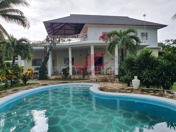 Exquisite Beachfront 4-Bedroom Villa for Sale in Malindi, Kilifi County Location: Malindi, Kilifi County Price: KSh 55 Million Contact: Call or WhatsApp +(254) 732675057 or [Click Here to Chat on WhatsApp](https://wa.me/254732675057) Discover the pinnacle of coastal luxury with this magnificent 4-bedroom, all-ensuite beachfront villa in Malindi, offering a serene blend of luxury, comfort, and natural beauty. Situated on a half-acre plot with panoramic views of the Indian Ocean, this villa embodies an exquisite coastal lifestyle with direct beach access. ### Property Highlights: - 4 Spacious, All-Ensuite Bedrooms: Each bedroom features inbuilt wardrobes and large windows, offering breathtaking sea views. - Servant Quarter (SQ): Dedicated space for added convenience. - Elegant Living Area: Includes a cozy fireplace and direct access to the beachfront garden, creating a seamless flow from indoor to outdoor spaces. - Modern Kitchen: Equipped with granite countertops and ample storage, perfect for both casual and formal gatherings. - Laundry Area: Provides ample space for convenience and functionality. ### Outdoor & Scenic Features: - Beachfront Garden & Sandy Shores: Step directly onto the pristine sandy shores, just steps from the serene waters of the Indian Ocean. - Swimming Pool: A large private pool surrounded by lush gardens, ideal for relaxation and entertaining. - Expansive Cabro Paved Driveway: Beautifully landscaped entrance with ample parking for residents and guests. - Sufficient Water Supply: Large water storage tanks ensure a reliable water supply. ### Why Choose This Villa? This villa offers an unparalleled experience of coastal living, ideal for those seeking luxury amidst nature’s beauty. With its proximity to Malindi’s vibrant town, international resorts, and dining options, this home is perfect for local and international buyers looking for a tranquil retreat or investment. Schedule Your Viewing Today! Enjoy exclusive coastal living with this stunning beachfront villa. ?? Call or WhatsApp: +(254) 732675057 or [Click Here to Chat on WhatsApp](https://wa.me/254732675057) #BeachfrontVillaMalindi #VillaForSaleKenya #MalindiRealEstate #KilifiCountyProperty #LuxuryCoastalLiving #BeachfrontProperty #RealEstateKenya #IndianOceanRetreat#MalindiBeachfrontVilla #ExpatLivingKenya #LuxuryHomesMalindi #KenyaBeachHouse #KenyaRealEstateForSale #KilifiBeachVilla #CoastalLuxuryLiving #KenyaInvestmentProperty #MalindiHolidayHome #KilifiCountyRealEstate #DiasporaInvestmentsKenya #BeachfrontPropertyKenya #KenyaDreamHome #MalindiExpatRetreat #IndianOceanVillas #KenyaLuxuryRealEstate #TouristVillaKenya #KenyaBeachRetreat #KenyaRealEstateInvestments #MalindiLuxuryProperty