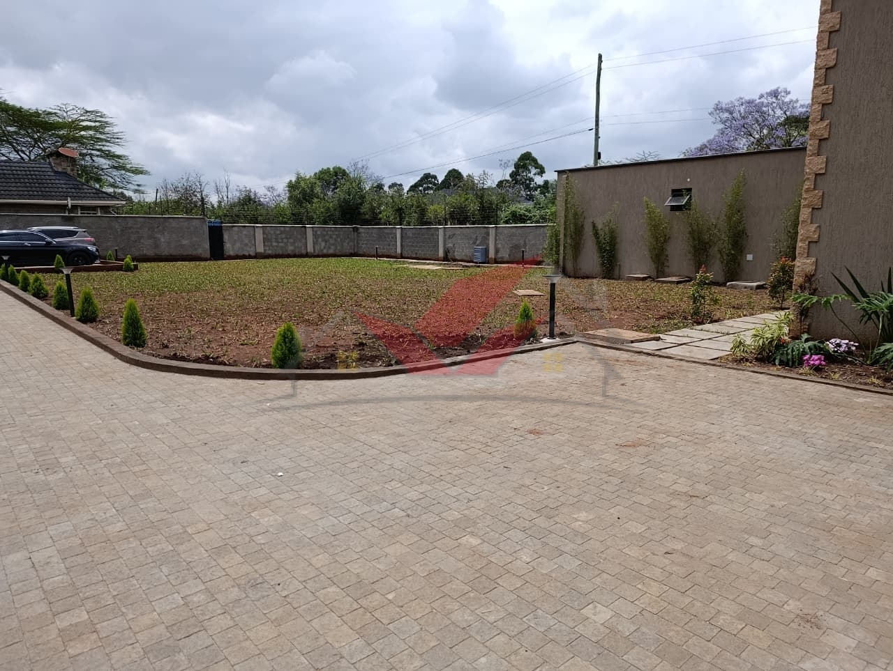 Modern 5-Bedroom Townhouse for Sale -- Hardy, Karen (Mukoma Road) Price: Ksh 125,000,000 Prime Half-Acre Property Gated Community of 3 Units Private Driveway Access Option Experience luxury, space, and sophistication in this brand-new 5-bedroom all-ensuite townhouse located in the prestigious Hardy, Karen area along Mukoma Road. Set within an exclusive gated community of just three homes, this property redefines modern family living with its elegant design, spacious interiors, and serene natural surroundings. ### Prime Location -- Hardy, Karen This property is perfectly positioned in the highly sought-after Hardy neighborhood of Karen---an area known for its tranquility, greenery, and elite lifestyle. It offers seamless access to top amenities including The Hub Karen, Galleria Mall, Karen Hospital, Brookhouse School, Hillcrest International School, Banda School, and a wide range of fine dining and entertainment venues. Enjoy the perfect balance between peaceful suburban living and easy city access. ### Property Features * 5 spacious ensuite bedrooms with premium finishes * 3 lounges, including a family/TV room and an upstairs relaxation area * Elegant living room and dining area designed for entertaining * 2 fully fitted modern kitchens * Study/office room ideal for remote work * Gym area / wellness space * Beautiful manicured garden for outdoor leisure * Ample parking space for several cars * Own private driveway for enhanced privacy ### Gated Community & Security Set in a secure compound of only 3 homes, this property ensures exclusive privacy, peace, and safety. It features electric fencing, 24/7 security guards, CCTV surveillance readiness, and a controlled access gate, offering residents total peace of mind. ### Why Invest in This Karen Property This luxurious 5-bedroom townhouse is more than just a home---it's a statement of success and comfort. Ideal for families, expatriates, or diaspora investors seeking premium property in Nairobi's upscale suburbs. With its modern design, half-acre space, and strategic location, it's one of the finest homes for sale in Hardy, Karen today. Contact us today to schedule a private viewing: Call / WhatsApp: 0732 675 057 #KarenHomes #LuxuryLiving #HardyKaren #MukomaRoad #KarenRealEstate #NairobiHomes #LuxuryHomesKenya #KarenLifestyle #DiasporaInvestments #RealEstateKenya #KarenPropertyForSale #DreamHomeKenya #LuxuryTownhouse #KarenLuxuryHomes #InvestInKenya #NairobiLuxuryLiving