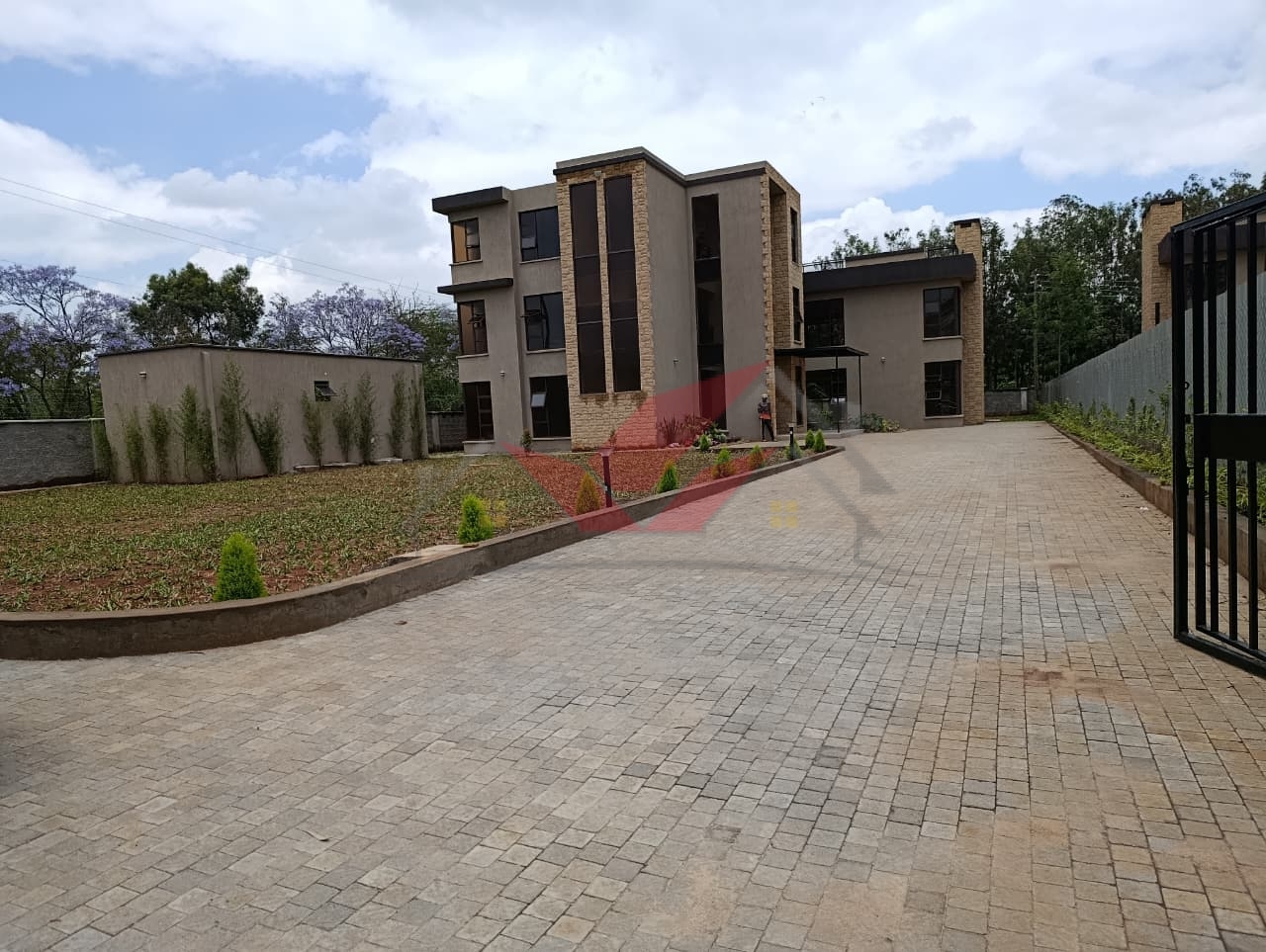 Modern 5-Bedroom Townhouse for Sale -- Hardy, Karen (Mukoma Road) Price: Ksh 125,000,000 Prime Half-Acre Property Gated Community of 3 Units Private Driveway Access Option Experience luxury, space, and sophistication in this brand-new 5-bedroom all-ensuite townhouse located in the prestigious Hardy, Karen area along Mukoma Road. Set within an exclusive gated community of just three homes, this property redefines modern family living with its elegant design, spacious interiors, and serene natural surroundings. ### Prime Location -- Hardy, Karen This property is perfectly positioned in the highly sought-after Hardy neighborhood of Karen---an area known for its tranquility, greenery, and elite lifestyle. It offers seamless access to top amenities including The Hub Karen, Galleria Mall, Karen Hospital, Brookhouse School, Hillcrest International School, Banda School, and a wide range of fine dining and entertainment venues. Enjoy the perfect balance between peaceful suburban living and easy city access. ### Property Features * 5 spacious ensuite bedrooms with premium finishes * 3 lounges, including a family/TV room and an upstairs relaxation area * Elegant living room and dining area designed for entertaining * 2 fully fitted modern kitchens * Study/office room ideal for remote work * Gym area / wellness space * Beautiful manicured garden for outdoor leisure * Ample parking space for several cars * Own private driveway for enhanced privacy ### Gated Community & Security Set in a secure compound of only 3 homes, this property ensures exclusive privacy, peace, and safety. It features electric fencing, 24/7 security guards, CCTV surveillance readiness, and a controlled access gate, offering residents total peace of mind. ### Why Invest in This Karen Property This luxurious 5-bedroom townhouse is more than just a home---it's a statement of success and comfort. Ideal for families, expatriates, or diaspora investors seeking premium property in Nairobi's upscale suburbs. With its modern design, half-acre space, and strategic location, it's one of the finest homes for sale in Hardy, Karen today. Contact us today to schedule a private viewing: Call / WhatsApp: 0732 675 057 #KarenHomes #LuxuryLiving #HardyKaren #MukomaRoad #KarenRealEstate #NairobiHomes #LuxuryHomesKenya #KarenLifestyle #DiasporaInvestments #RealEstateKenya #KarenPropertyForSale #DreamHomeKenya #LuxuryTownhouse #KarenLuxuryHomes #InvestInKenya #NairobiLuxuryLiving