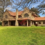 Exterior view of a modern 5-bedroom all-ensuite luxury house with DSQ for sale in Windyridge Karen, located within a secure gated community. Price 105M Negotiable