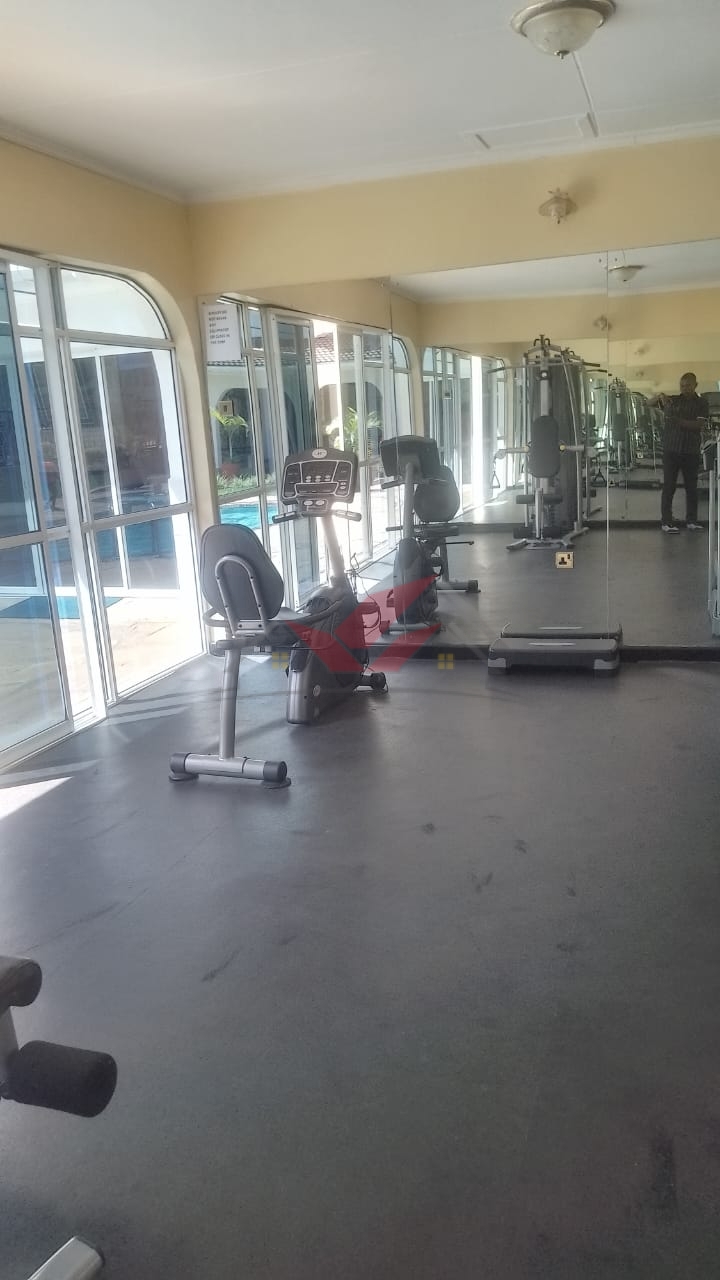 Front view of elegant 3-bedroom all-ensuite house for rent in Karen Bogani, featuring a gated entrance, lush landscaping, and modern design.