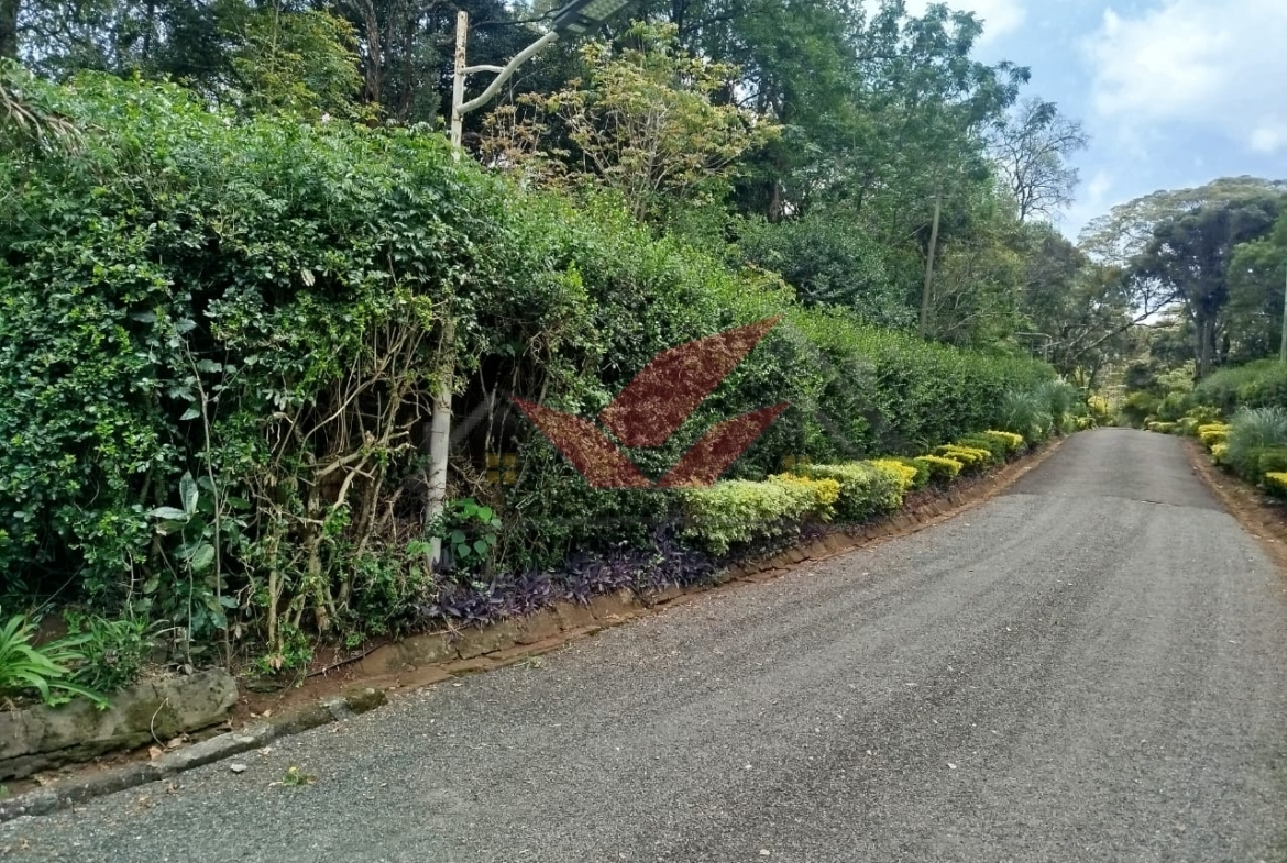 Buy 0.5-acre plot in Mwitu, Karen. Ready title deed, secure gated community, lush greenery, and prime Nairobi location. Ideal for your dream home.