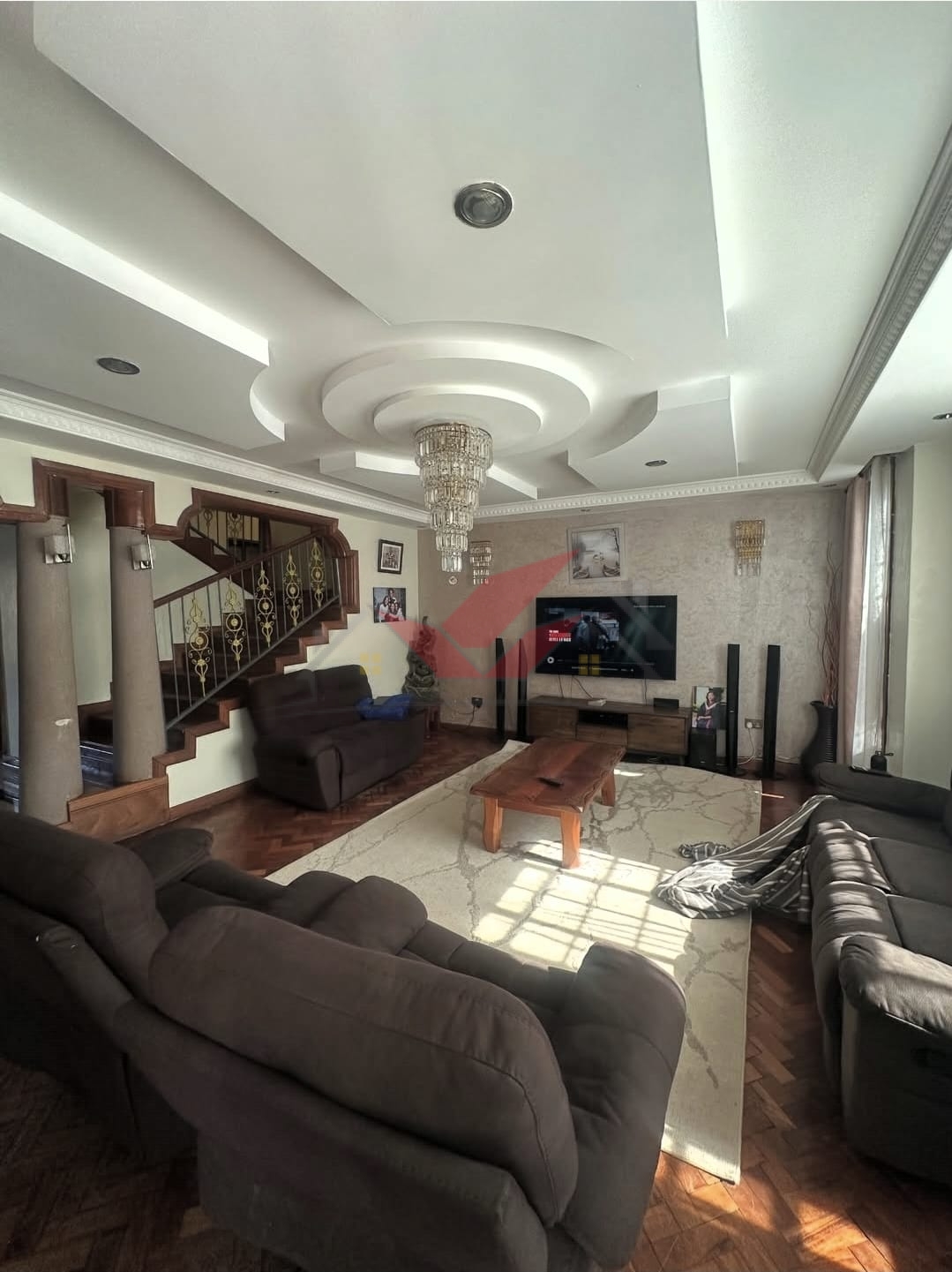 Spacious light-filled lounge and dining area in a luxury Langata family home.
