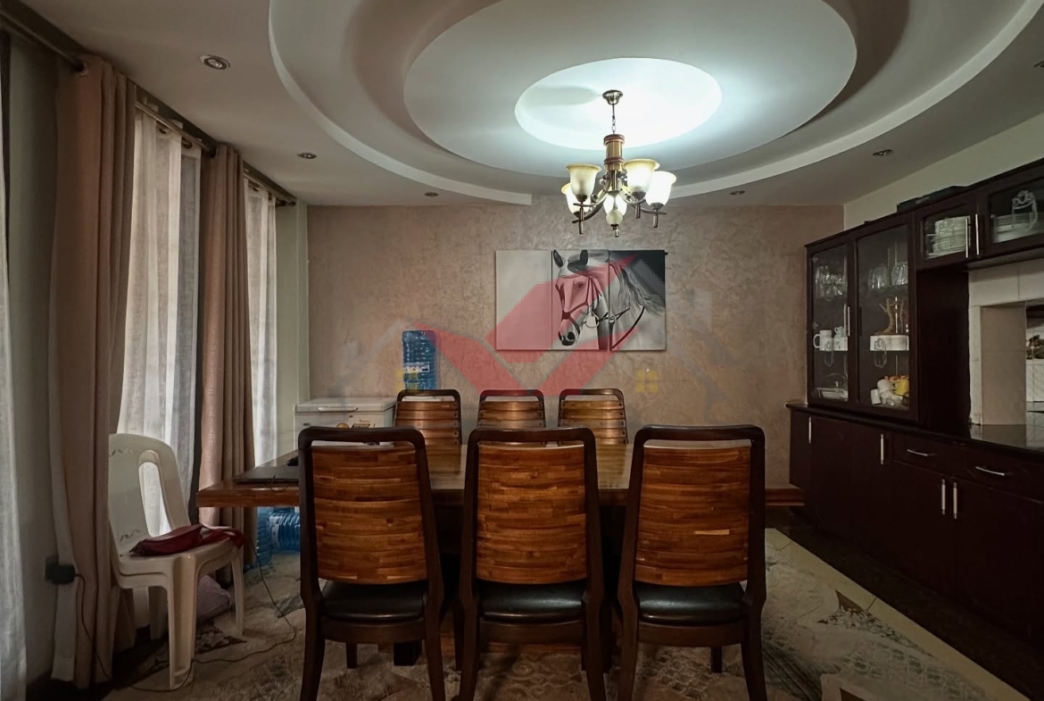Spacious light-filled lounge and dining area in a luxury Langata family home.