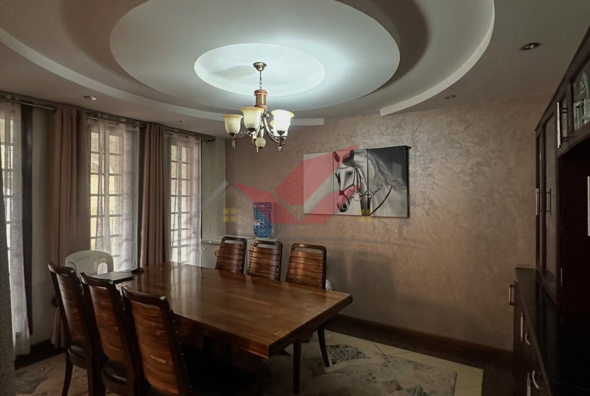 Spacious light-filled lounge and dining area in a luxury Langata family home.