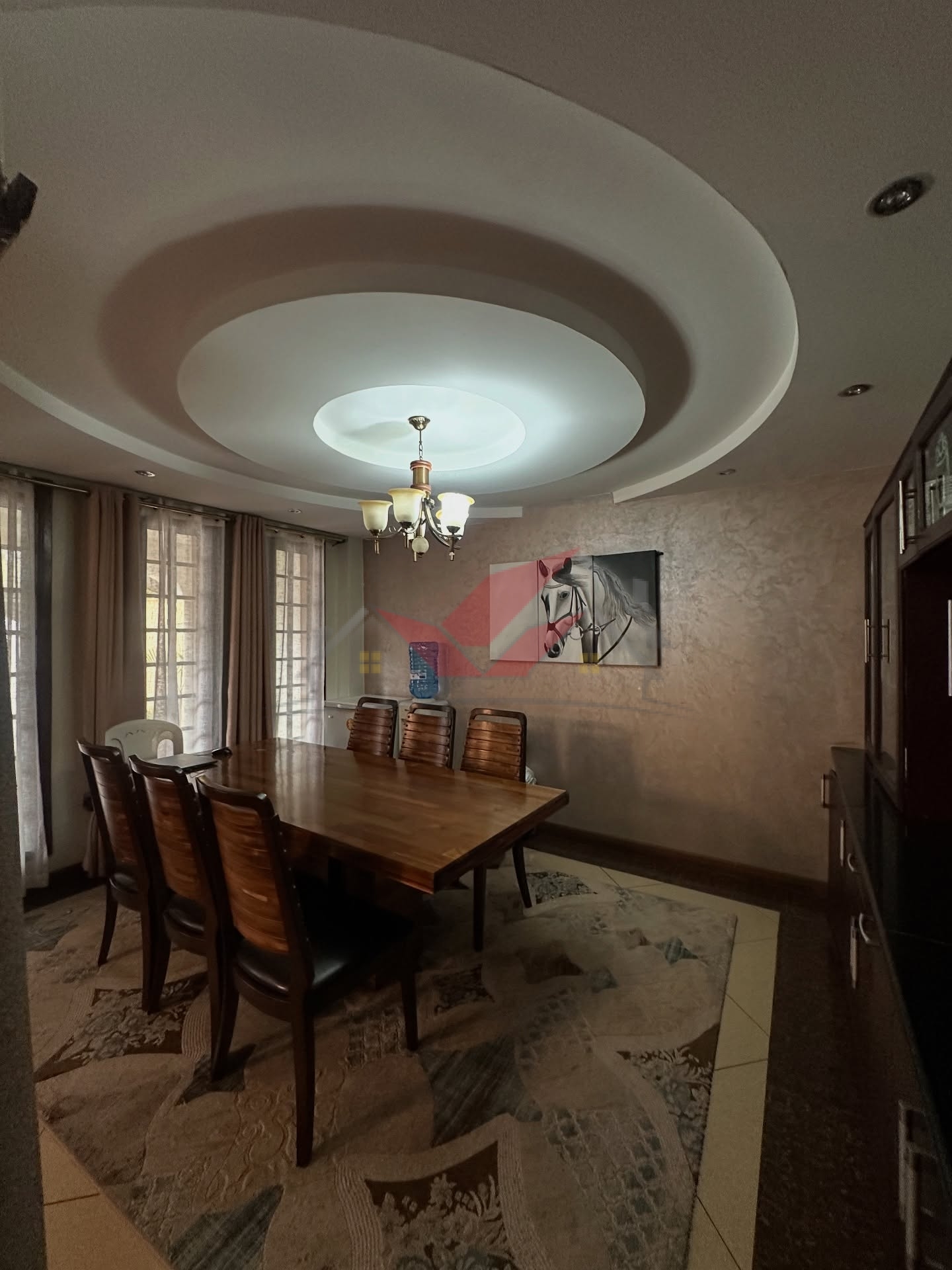 Spacious light-filled lounge and dining area in a luxury Langata family home.