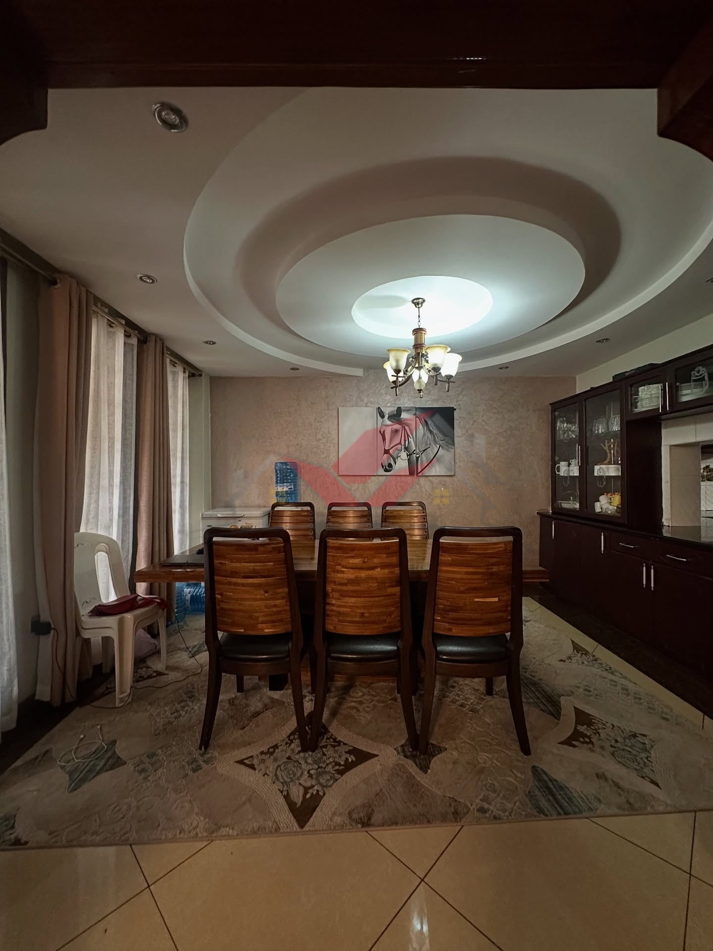 Spacious light-filled lounge and dining area in a luxury Langata family home.