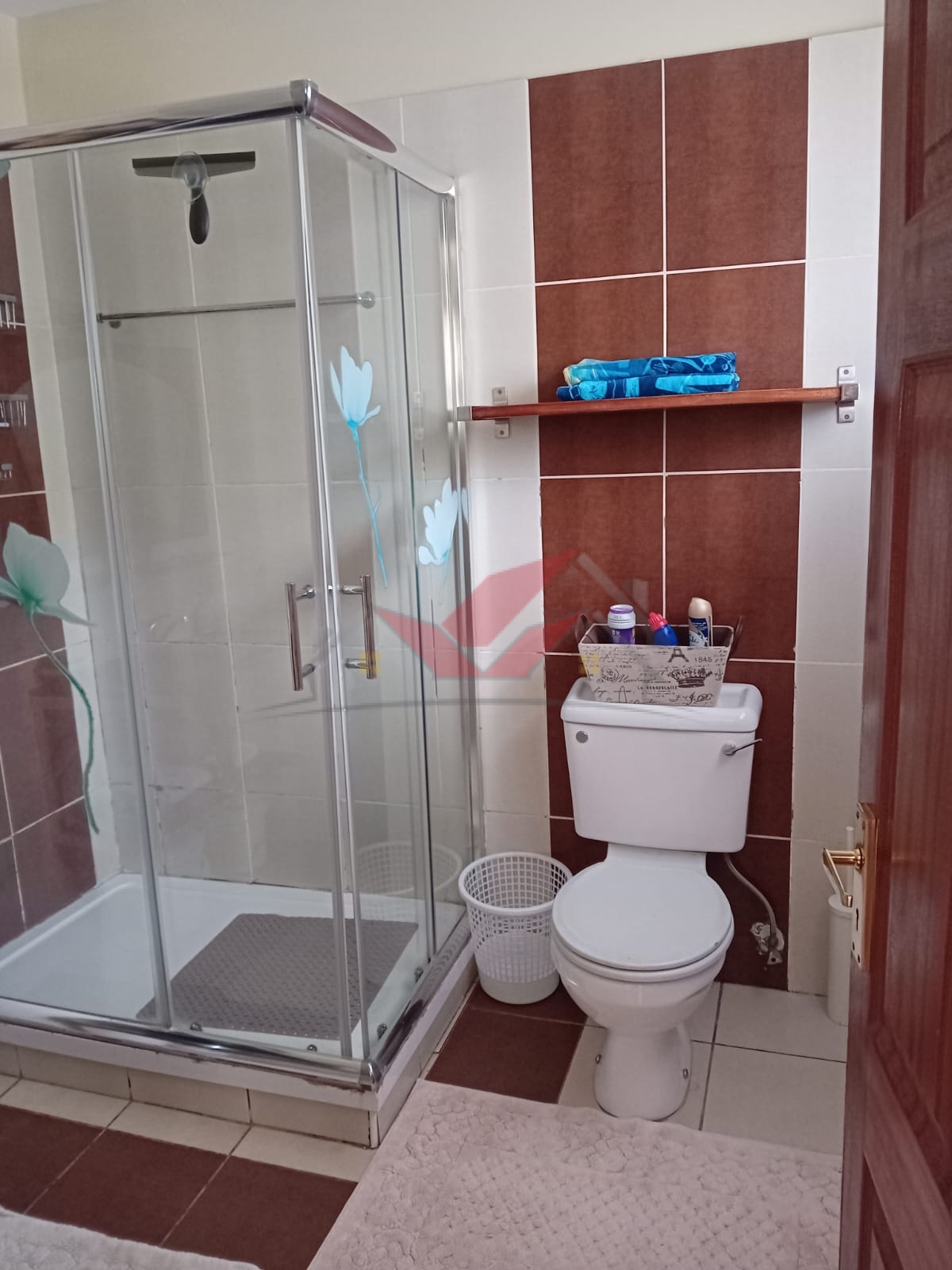 Cozy fully furnished living room and bedroom of a 1-bedroom rental cottage in Miotoni Karen Nairobi.