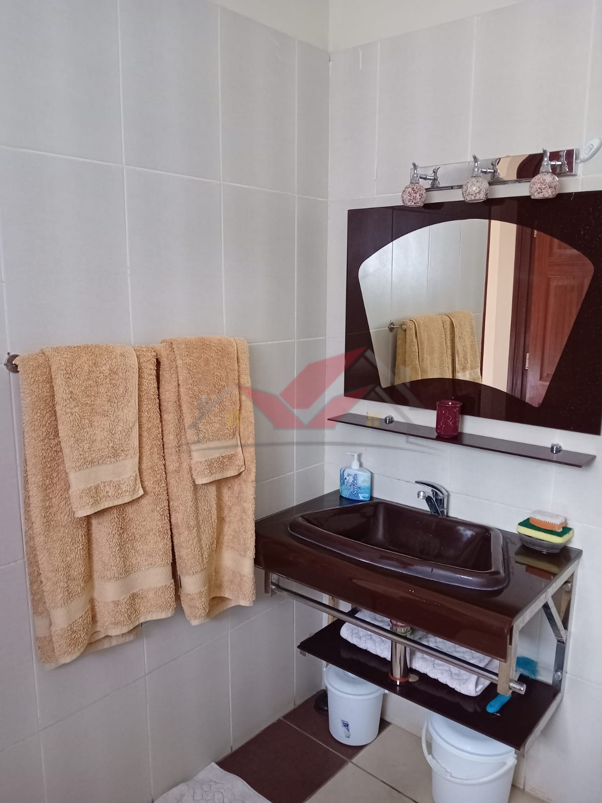 Cozy fully furnished living room and bedroom of a 1-bedroom rental cottage in Miotoni Karen Nairobi.