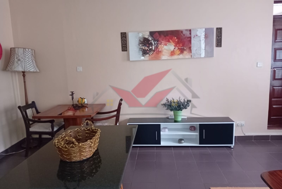 Cozy fully furnished living room and bedroom of a 1-bedroom rental cottage in Miotoni Karen Nairobi.