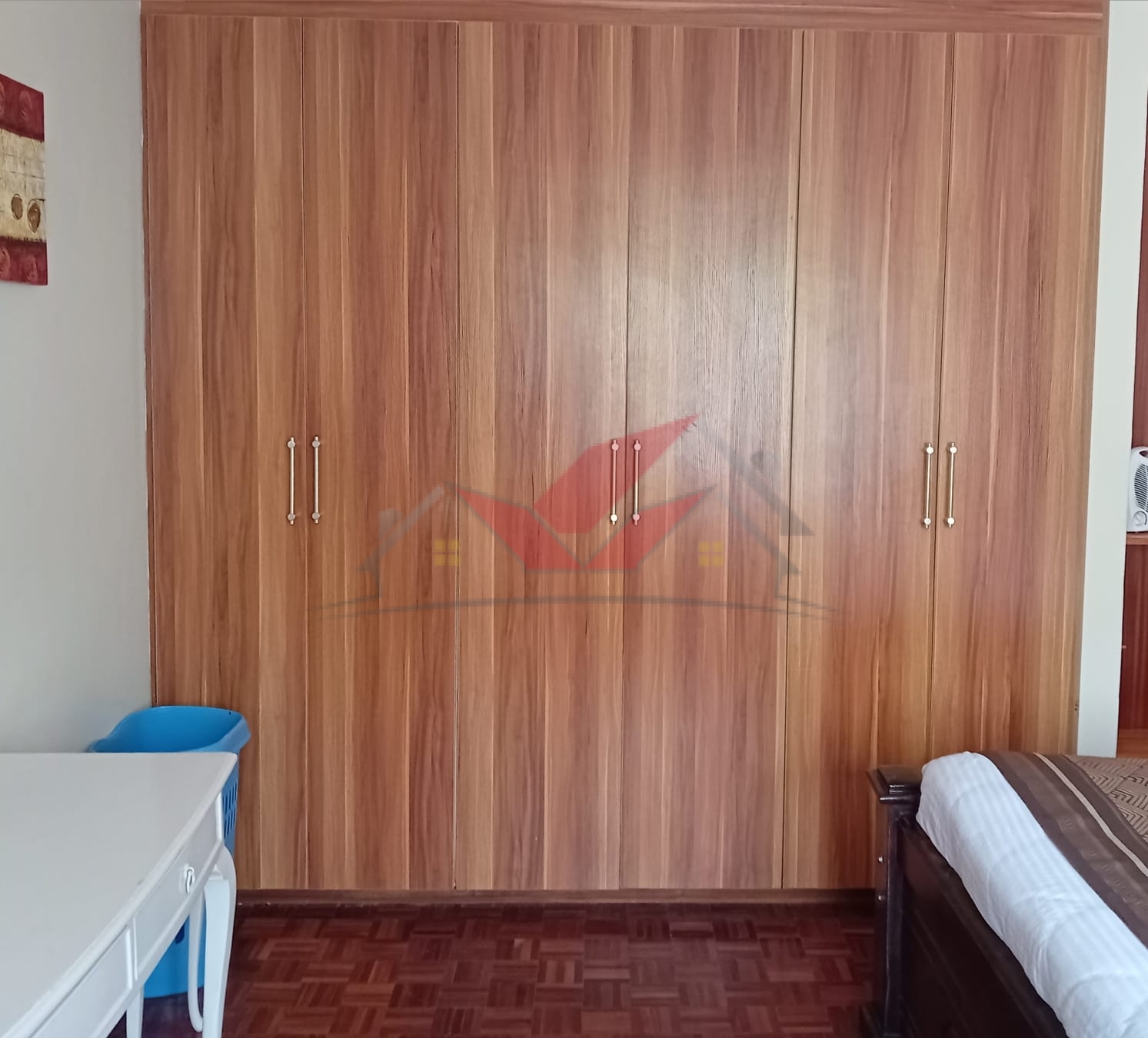 Cozy fully furnished living room and bedroom of a 1-bedroom rental cottage in Miotoni Karen Nairobi.