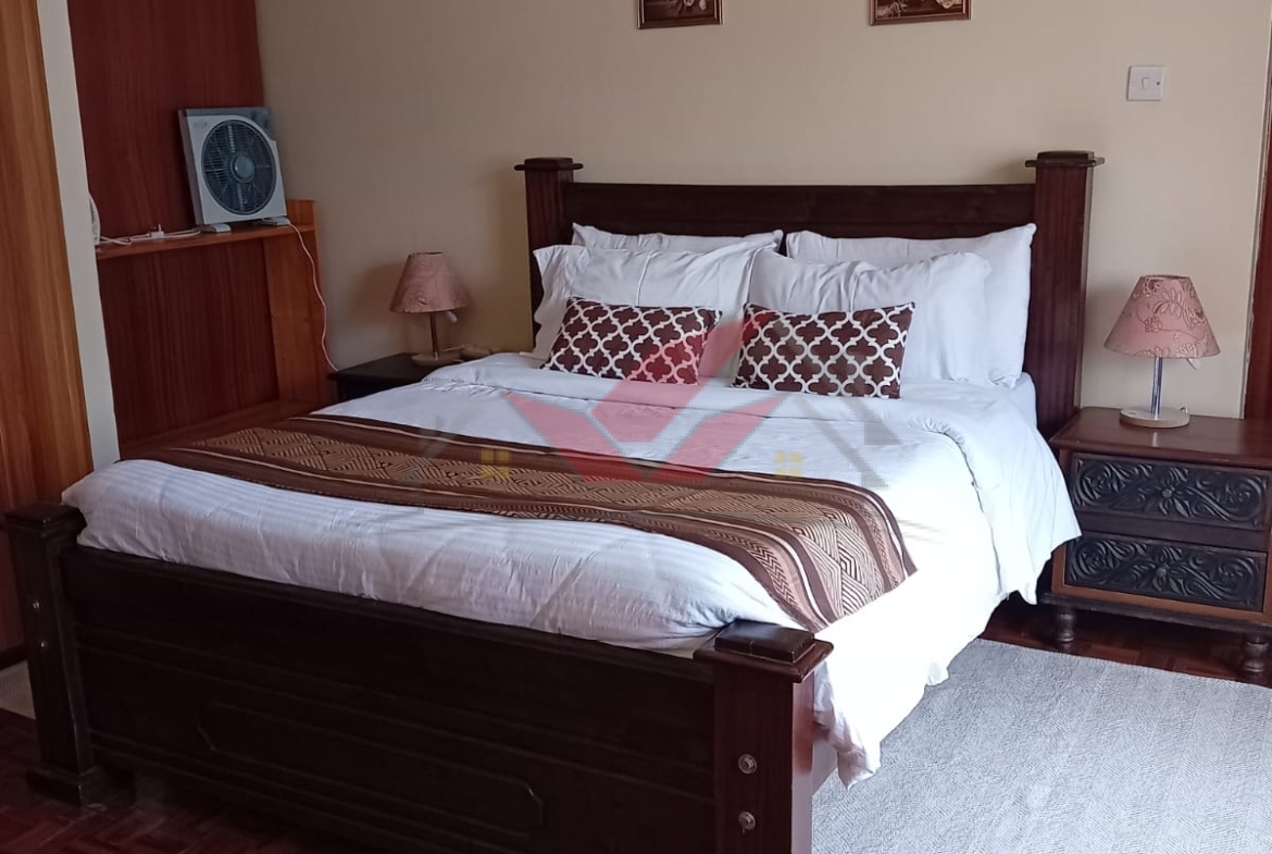 Cozy fully furnished living room and bedroom of a 1-bedroom rental cottage in Miotoni Karen Nairobi.