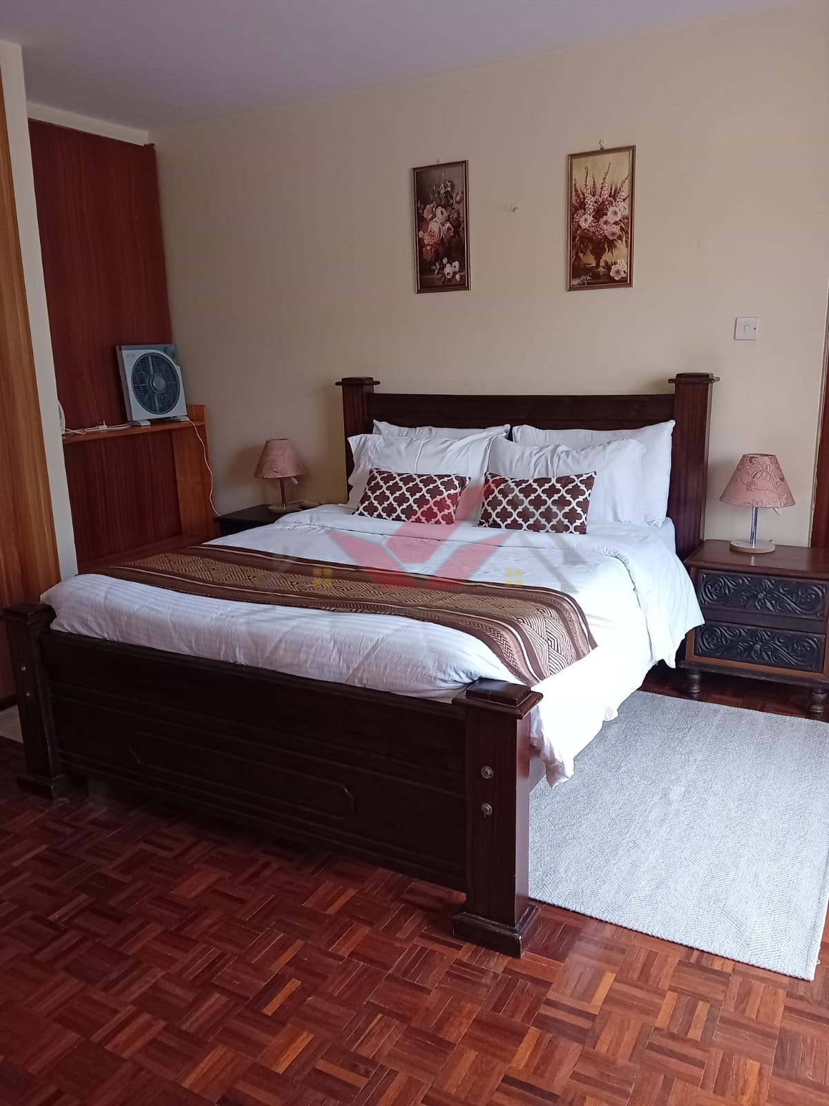 Cozy fully furnished living room and bedroom of a 1-bedroom rental cottage in Miotoni Karen Nairobi.