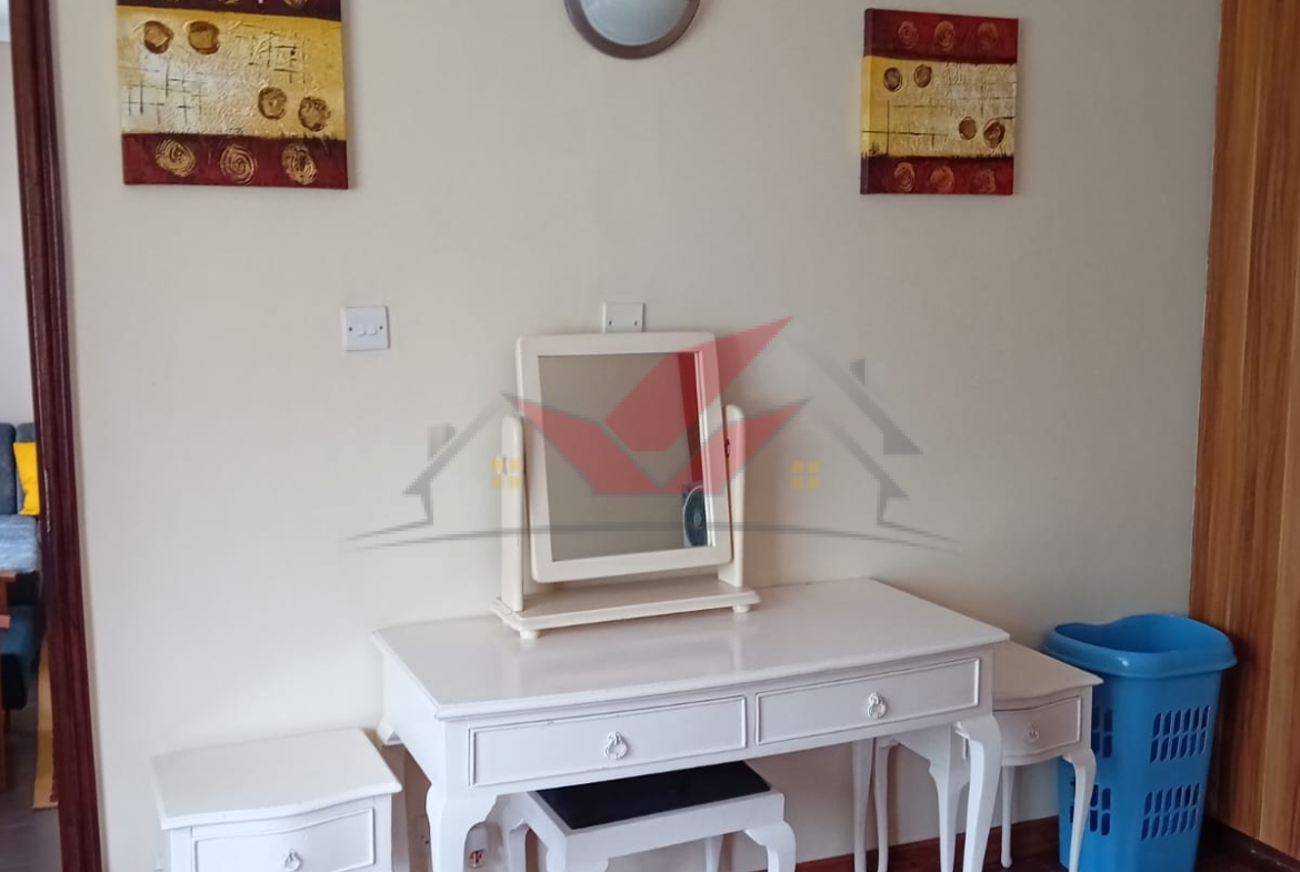 Cozy fully furnished living room and bedroom of a 1-bedroom rental cottage in Miotoni Karen Nairobi.