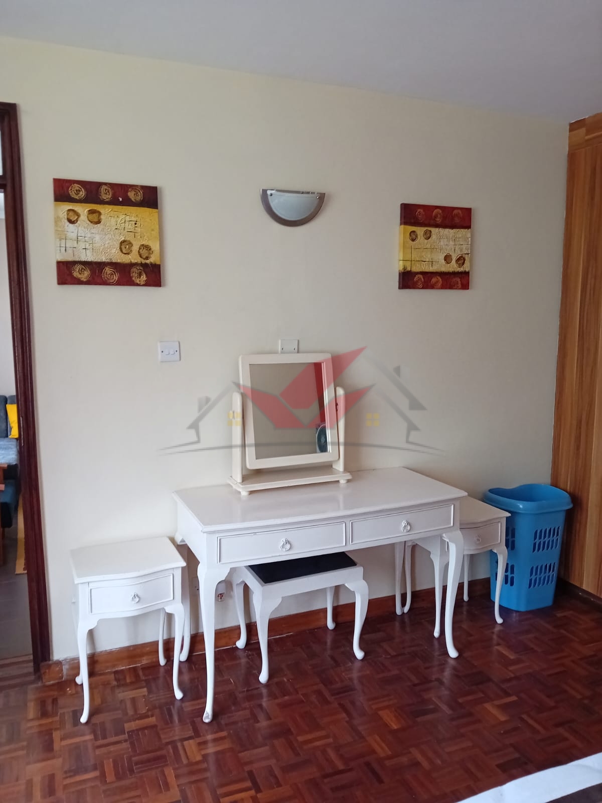 Cozy fully furnished living room and bedroom of a 1-bedroom rental cottage in Miotoni Karen Nairobi.